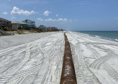 Shorepipe stretches thousands of feet along the beach to efficiently deliver sand to the fill template