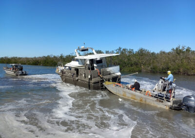 Crews removing a 42’ cabin cruiser from Don Pedro State Park